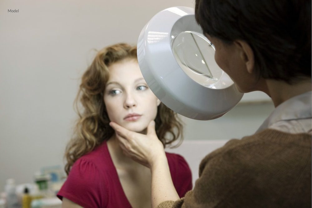 Woman getting her skin checked for skin cancer.