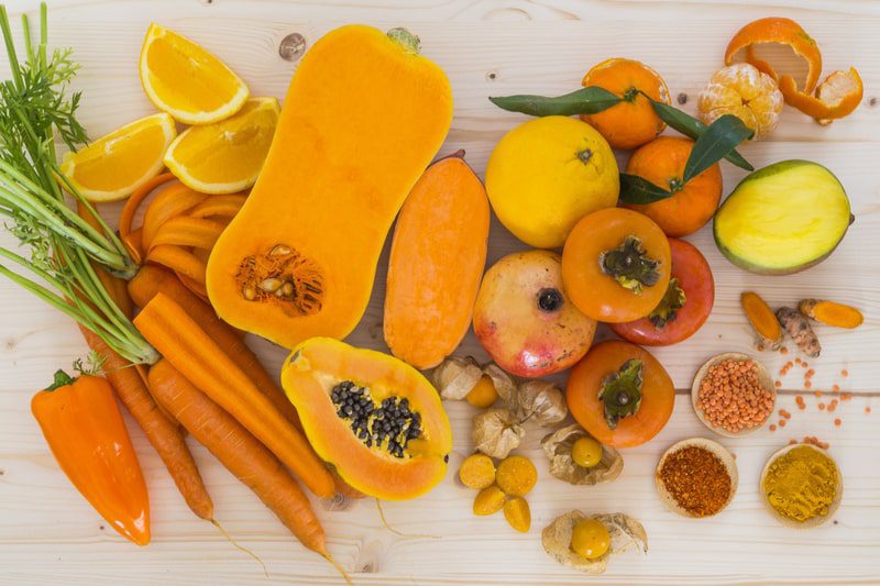 Foods high in beta carotene like squash, carrots, peppers, and mangoes.