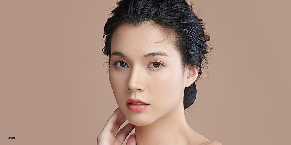 Beautiful young asian woman look at the camera