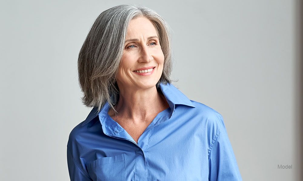 Profile of a mature woman in a blue blouse