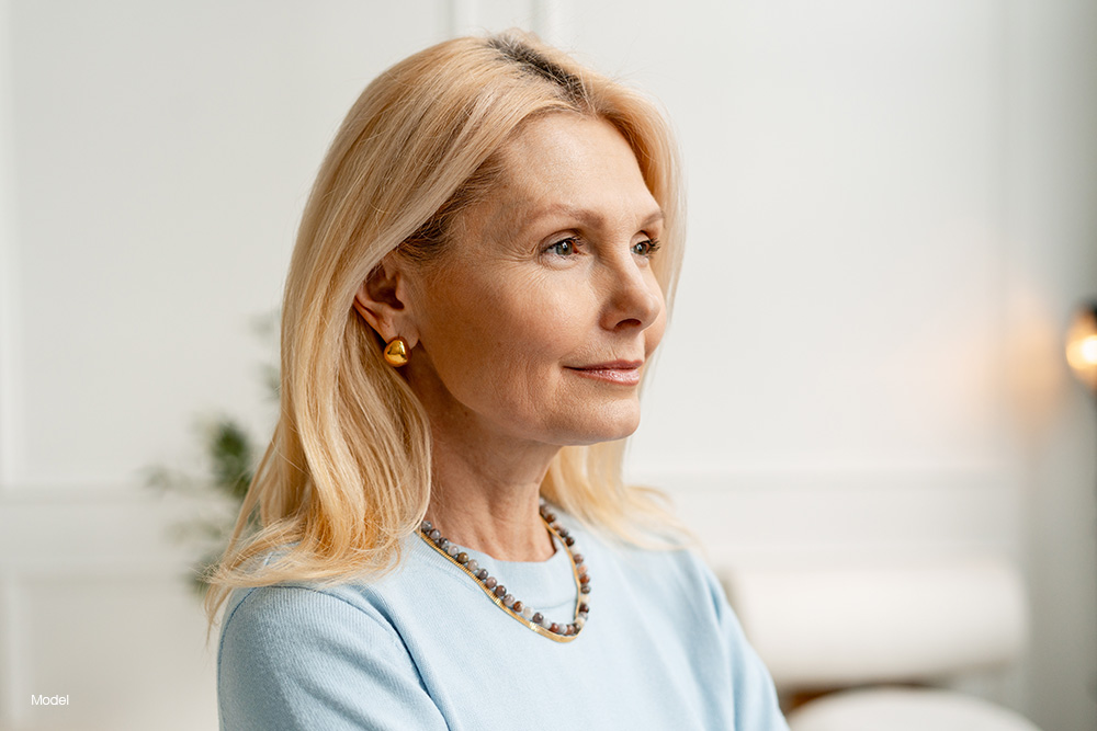 Profile of a mature woman in a blue blouse 