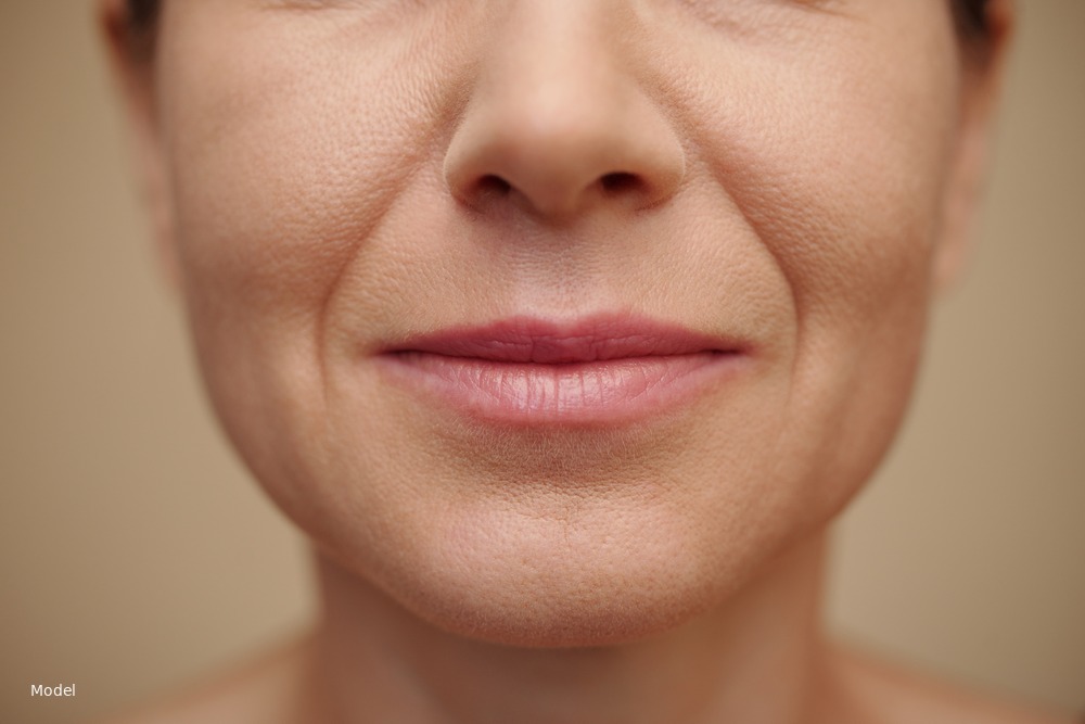 Close-up of mature lower face, mouth and chin with natural lines